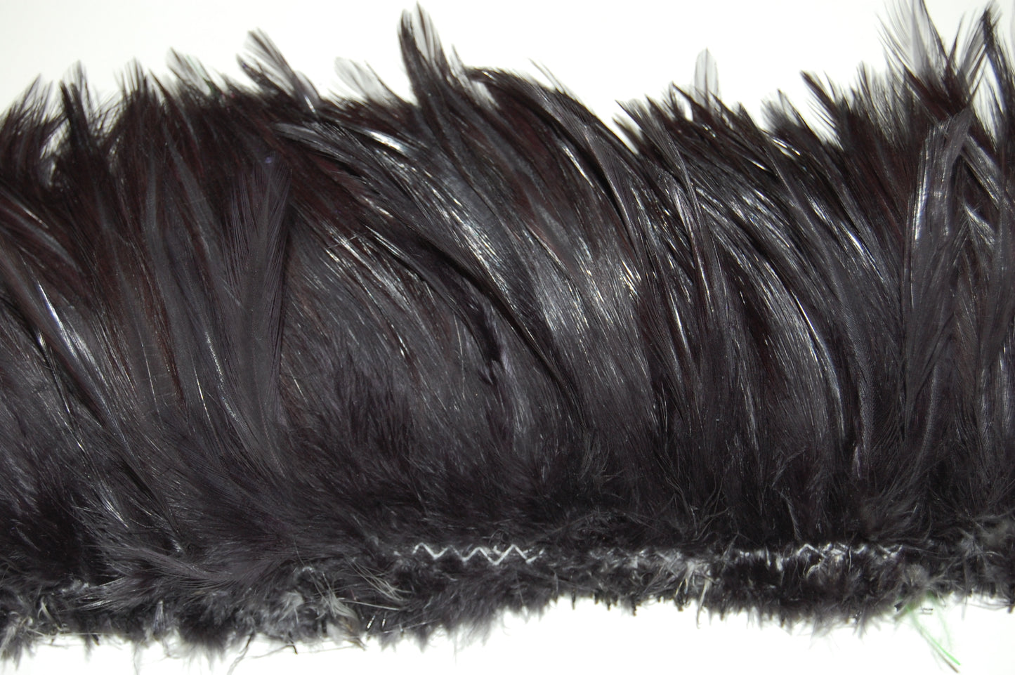 A close up of a hacker feather dark grey