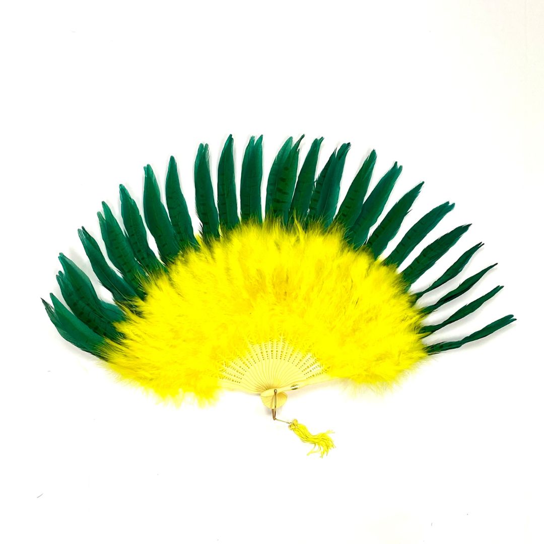 A yellow and green marabou fan with pheasant spread out on a white background 