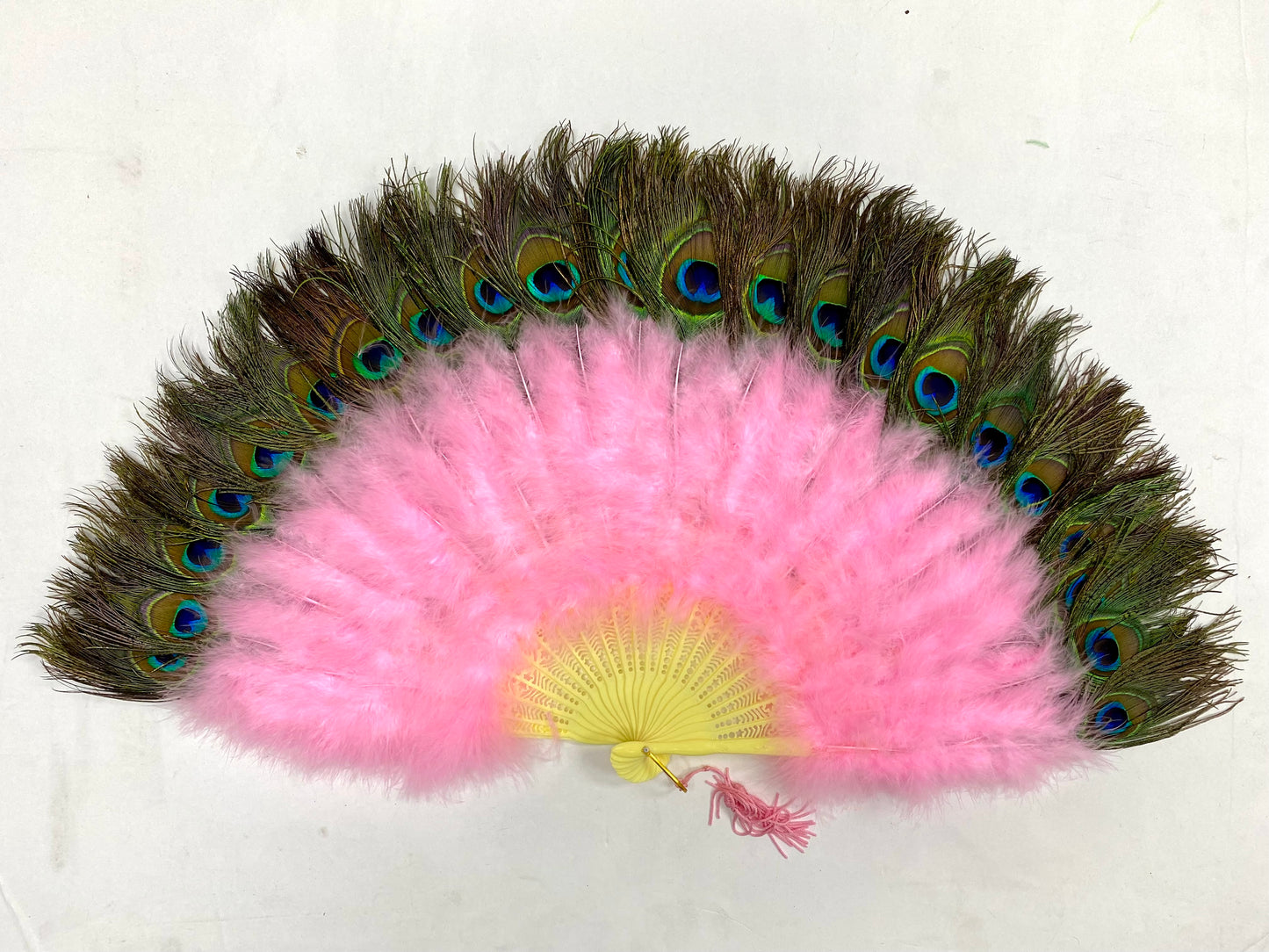 A pink marabou fan with peacock tips