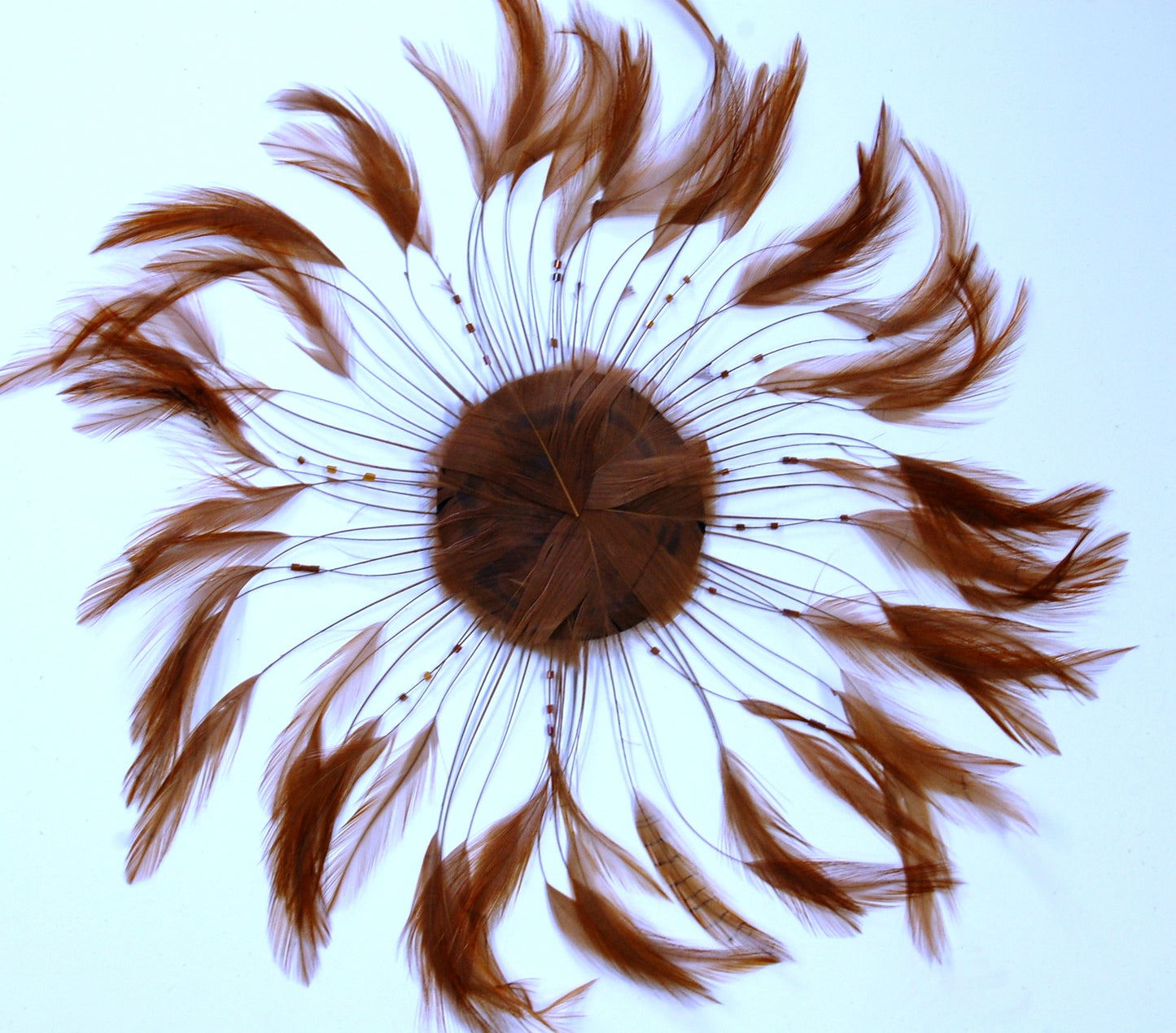 A camel colored feather pinwheel