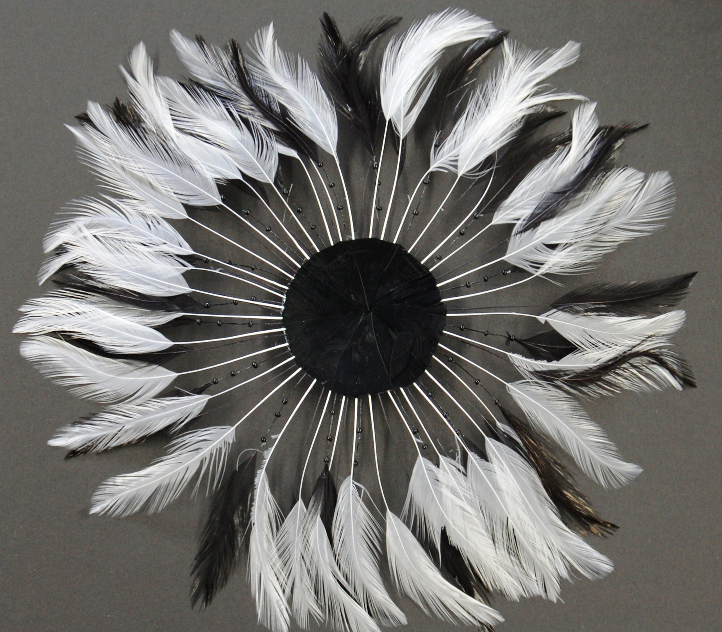 A black and white pinwheel on grey background