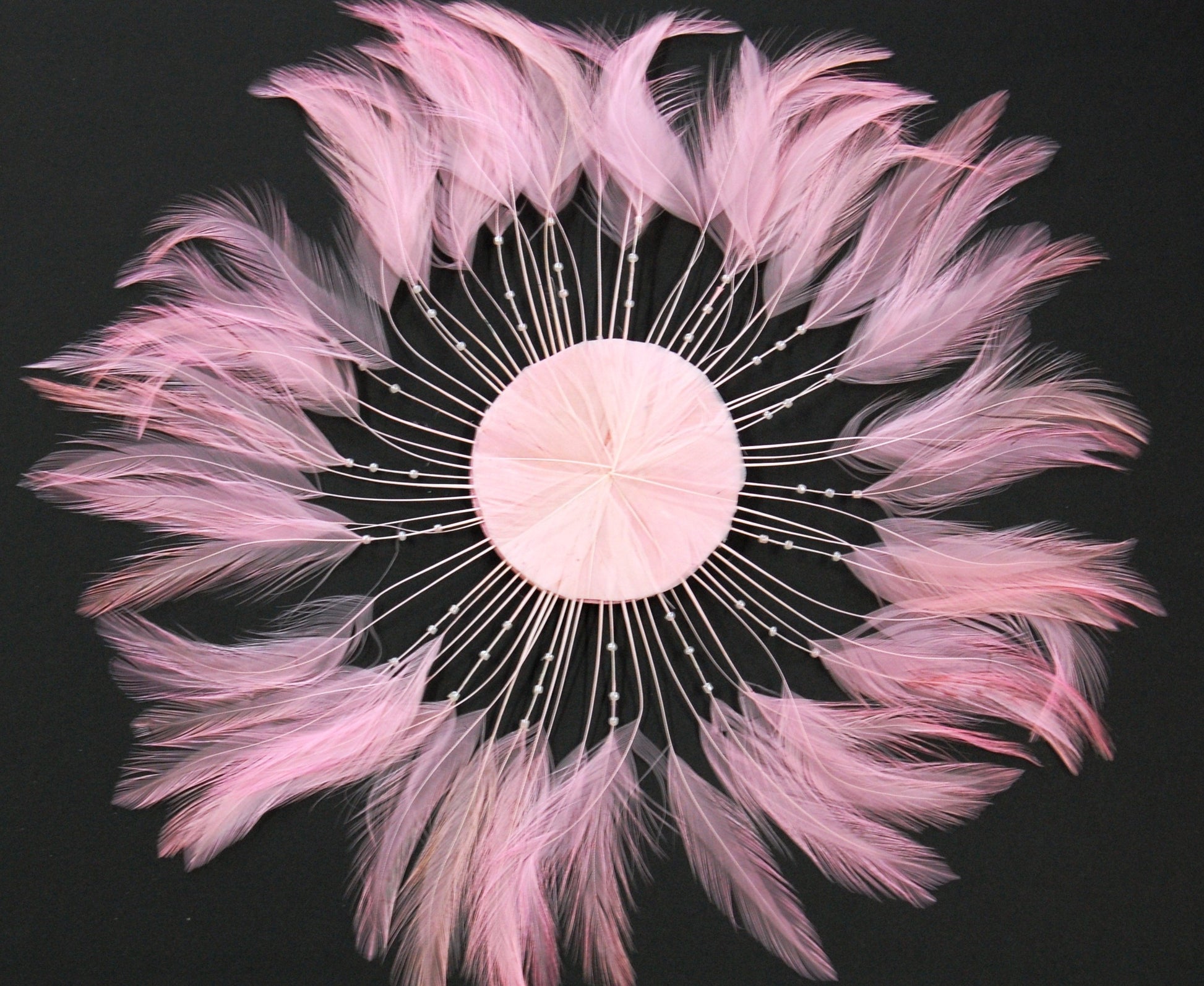 a light pink feather pinwheel