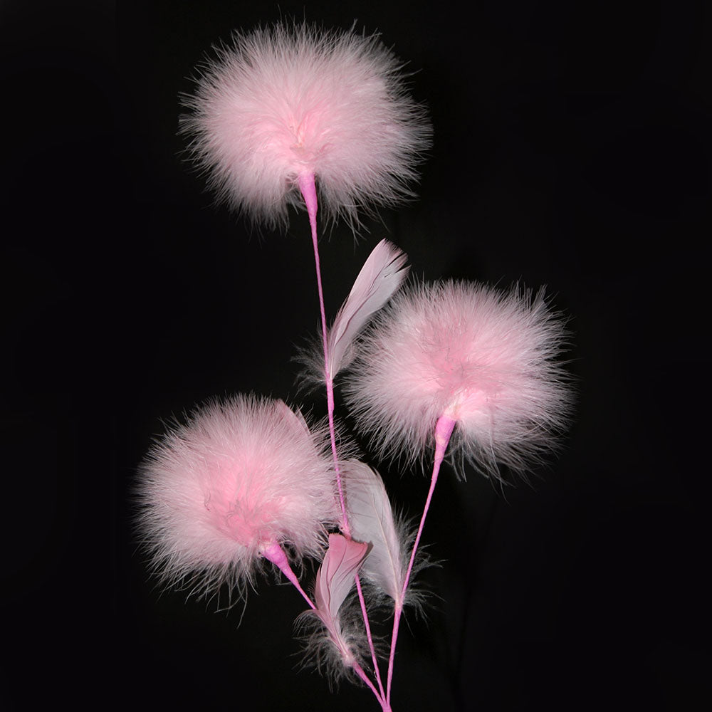 pink feather flowers by eskay feathers on a black background