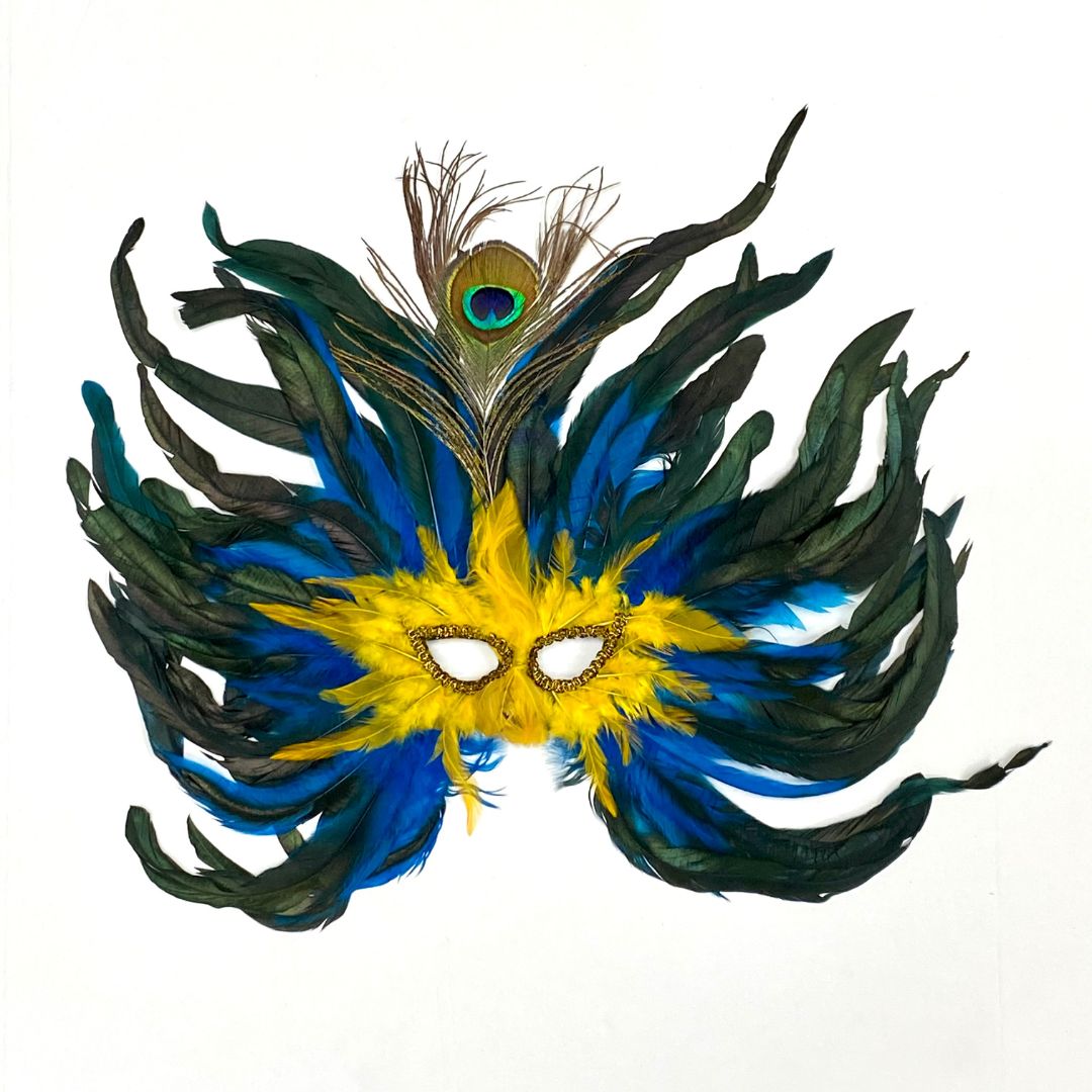 A beautiful yellow, blue, and black feather mask with a peacock feather