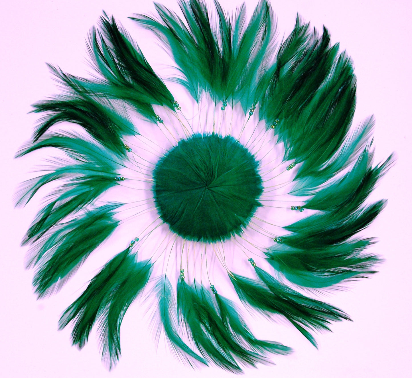 a kelly green colored feather pinwheel