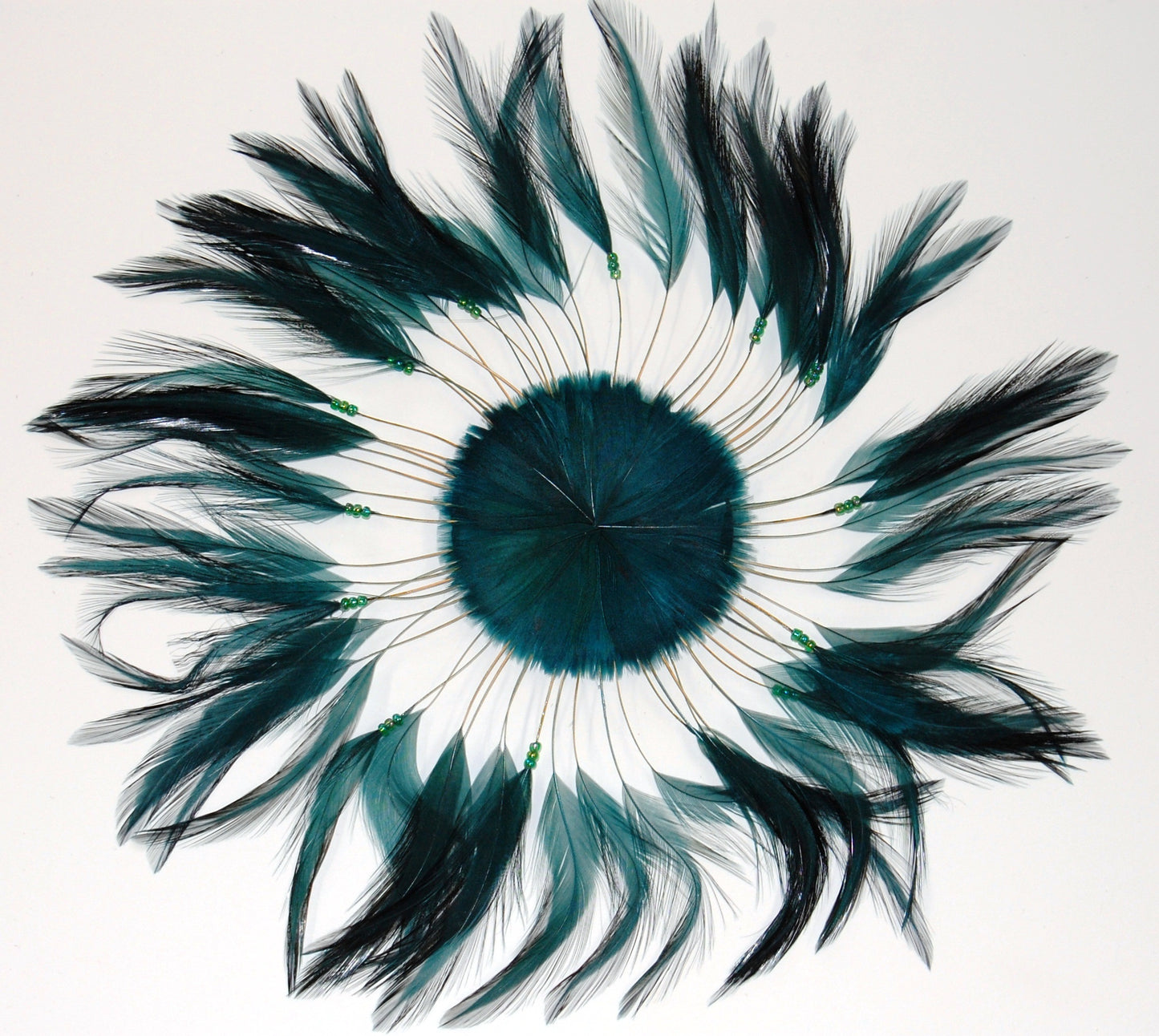 a hunter green colored feather pinwheel