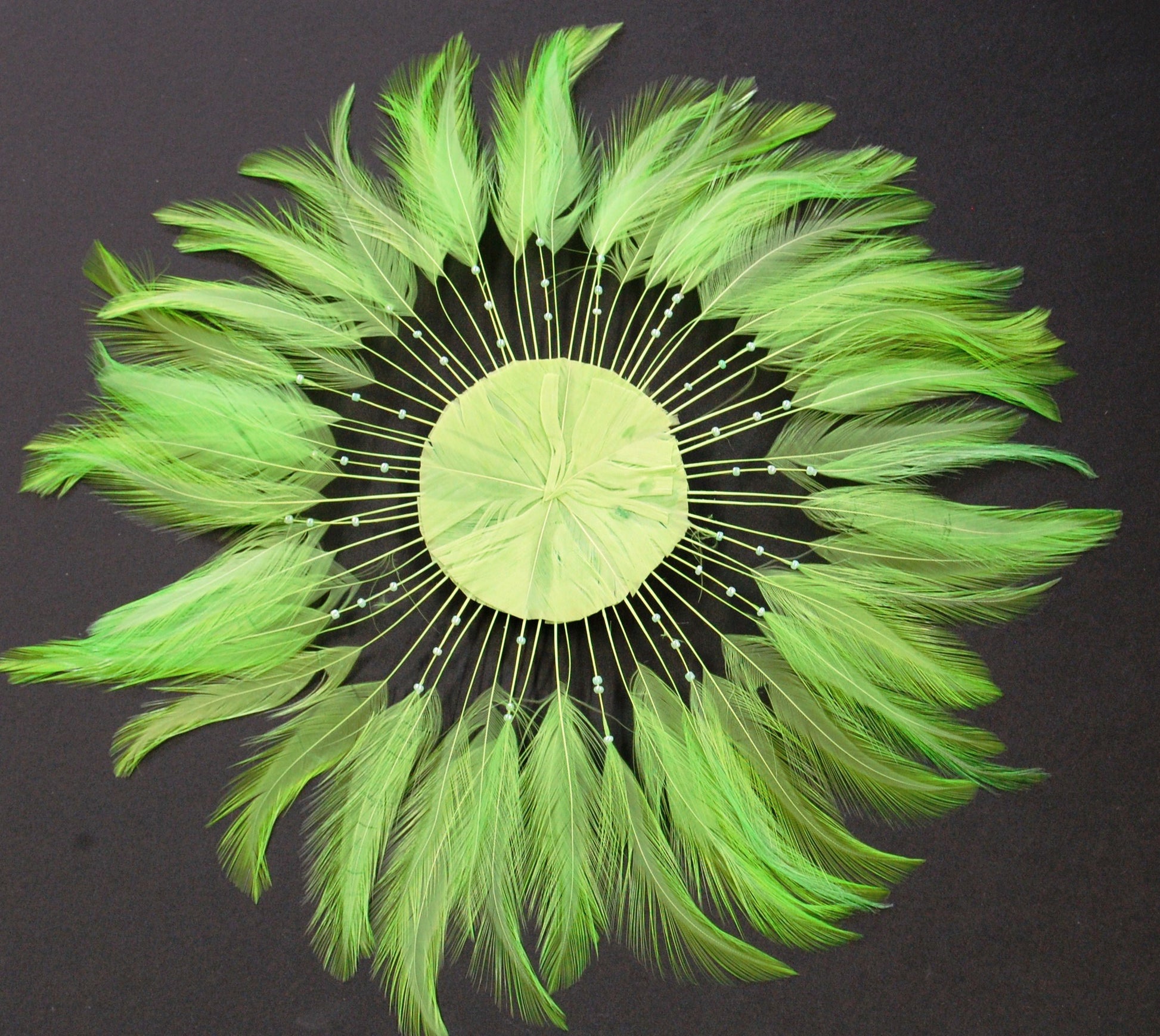 a lime colored feather pinwheel