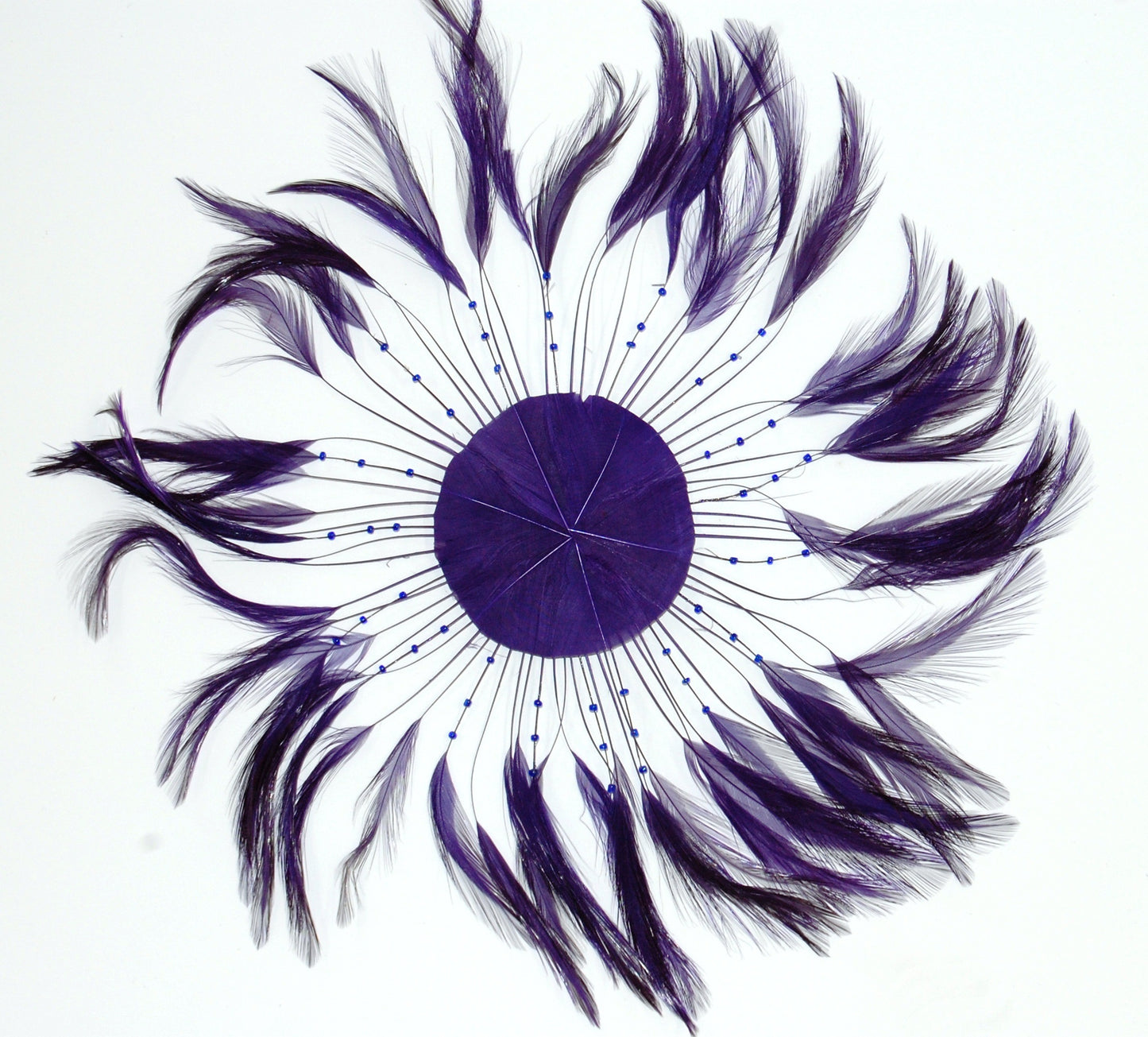 a purple colored feather pinwheel